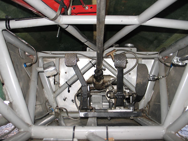 The complete pedal and master cylinder assembly is mounted on a sled.