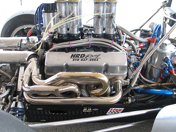 Custom nickel plated 4-into-1 headers. Note that the roll hoop braces come off the forward header flanges.