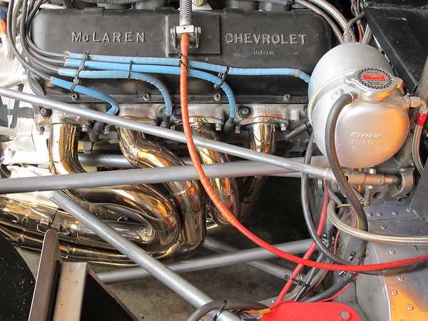 The McLaren team used stainless steel headers. Trojan-produced M8Fs came with mild steel headers.