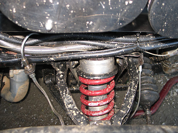 Carrera coilover shock absorbers with adjustable rebound valves. Eibach 550# springs.