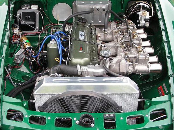 Previous set-up: triple Weber 45DCOE carburetors on cast alloy manifolds.