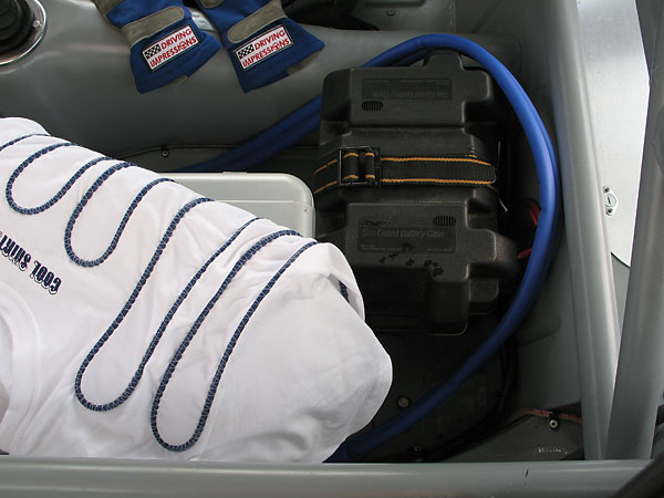 Cool Shirt, laying on top of the icebox that contains its cooling fluid and pump.