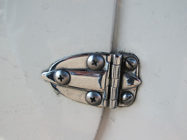 Exotic lightweight vintage racecar door hinges.