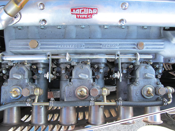 Warneford Design intake manifold supports triple Weber 45DCOE carburetors.