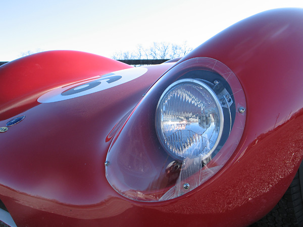 Molded perspex headlamp covers.