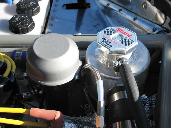 Custom fabricated aluminum coolant header tank with Stant Racing Division 21-25psi pressure cap.
