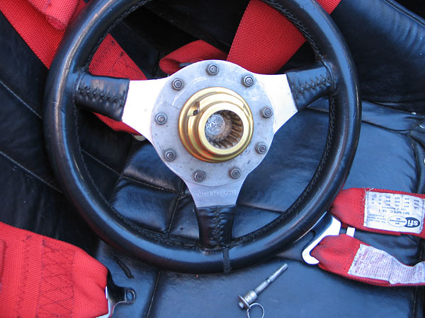 A pip pin secures the quick release steering wheel hub.